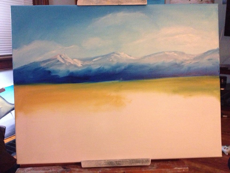 Let your fingers glide across the mountains base and make some blending magic happen. Your fingers will pick up some blue you can work into the land.