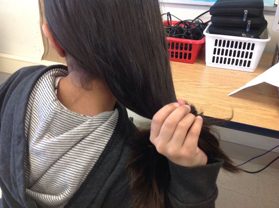 Let your hair out and comb out the tangles.