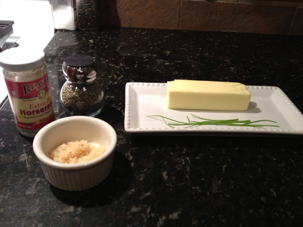 Lets begin with our compound butter. Bring one stick of butter to room temperature. I am using horseradish, garlic, chives and herbs de provence to flavor the compound.