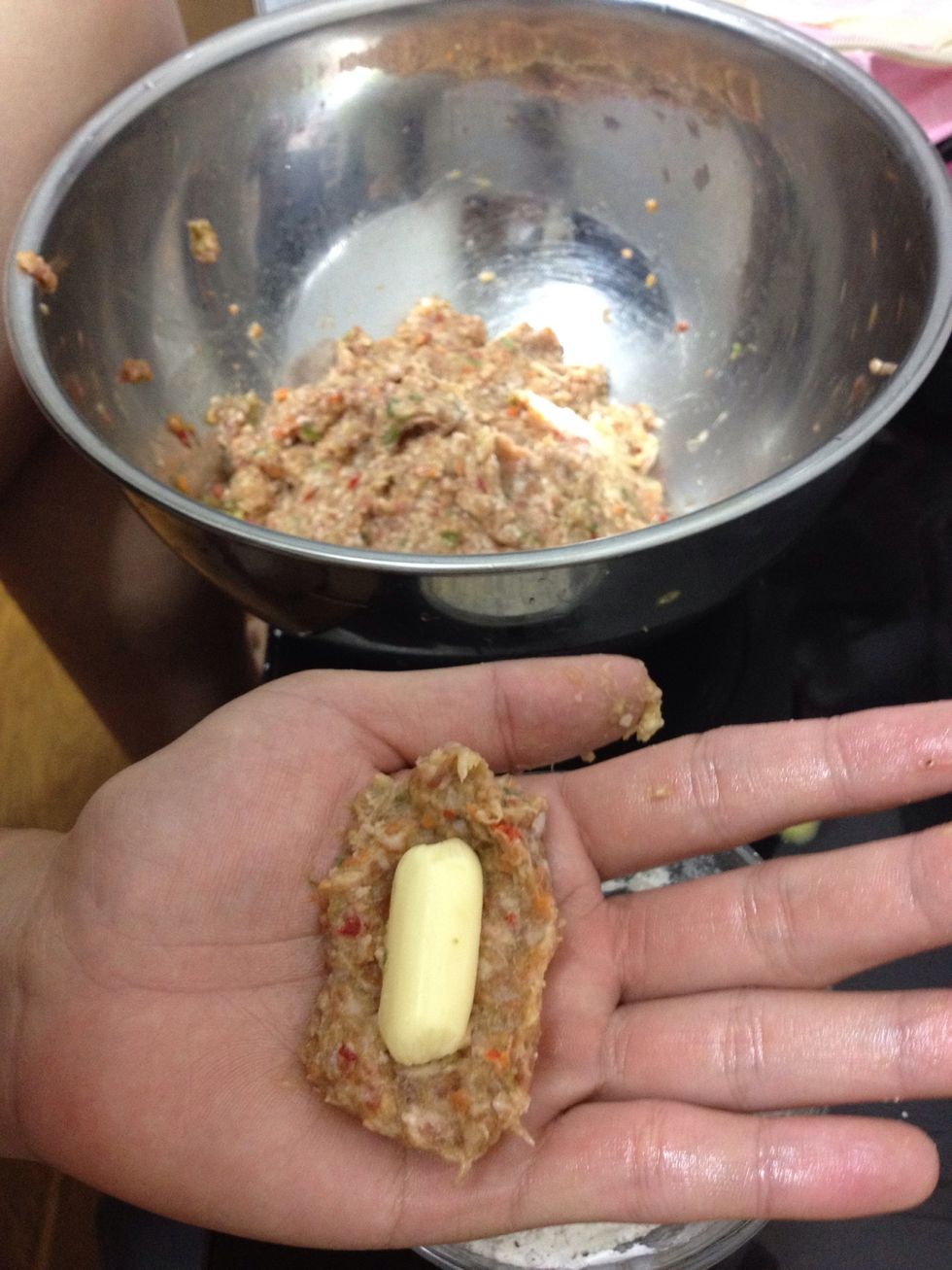 lets do first the cheese sticks. just wrap the cheese with ground beef