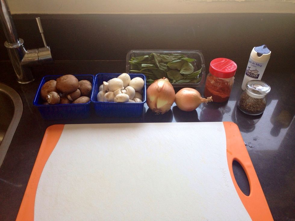 Lets get all the ingredients ready for the sauce - 2 onions, handful of basil leaves, mushrooms, 2 garlic cloves, paprika, salt & pepper
