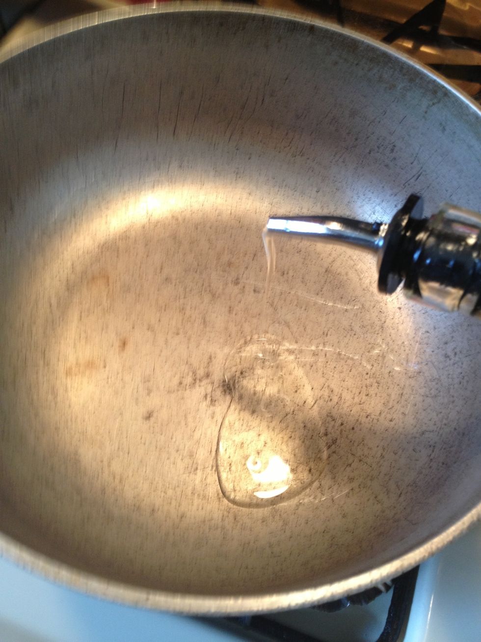 Lets make the sauce. In a pot over medium heat add the oil .