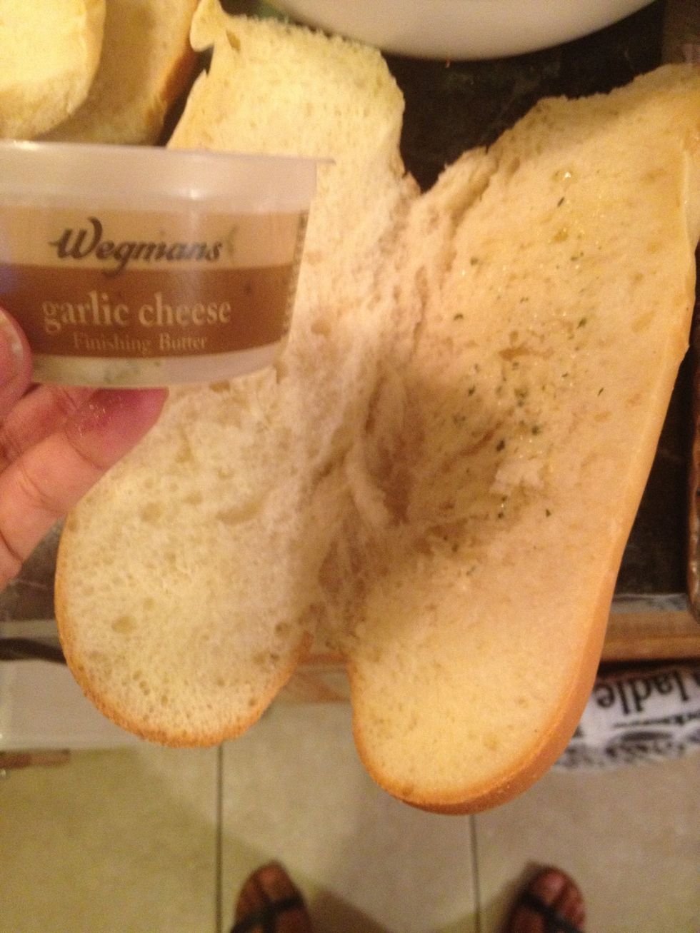 Lets start by grilling our baguettes. I like to spread garlic cheese butter on the bread. You can also spread butter. garlic powder and some cheese on the bread and continue with this recipe.