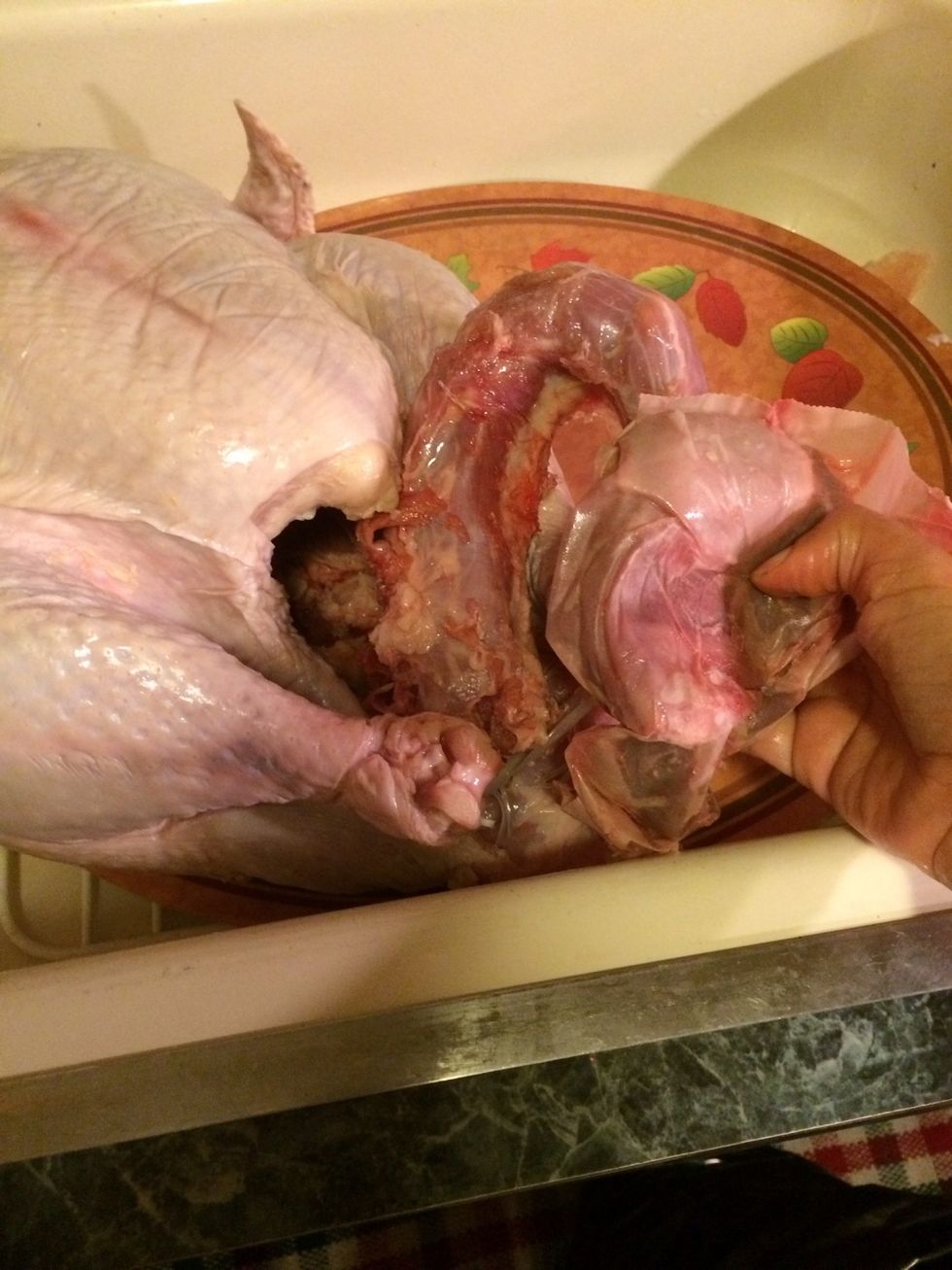 Lets start by removing the giblets from inside the cavity of the turkey