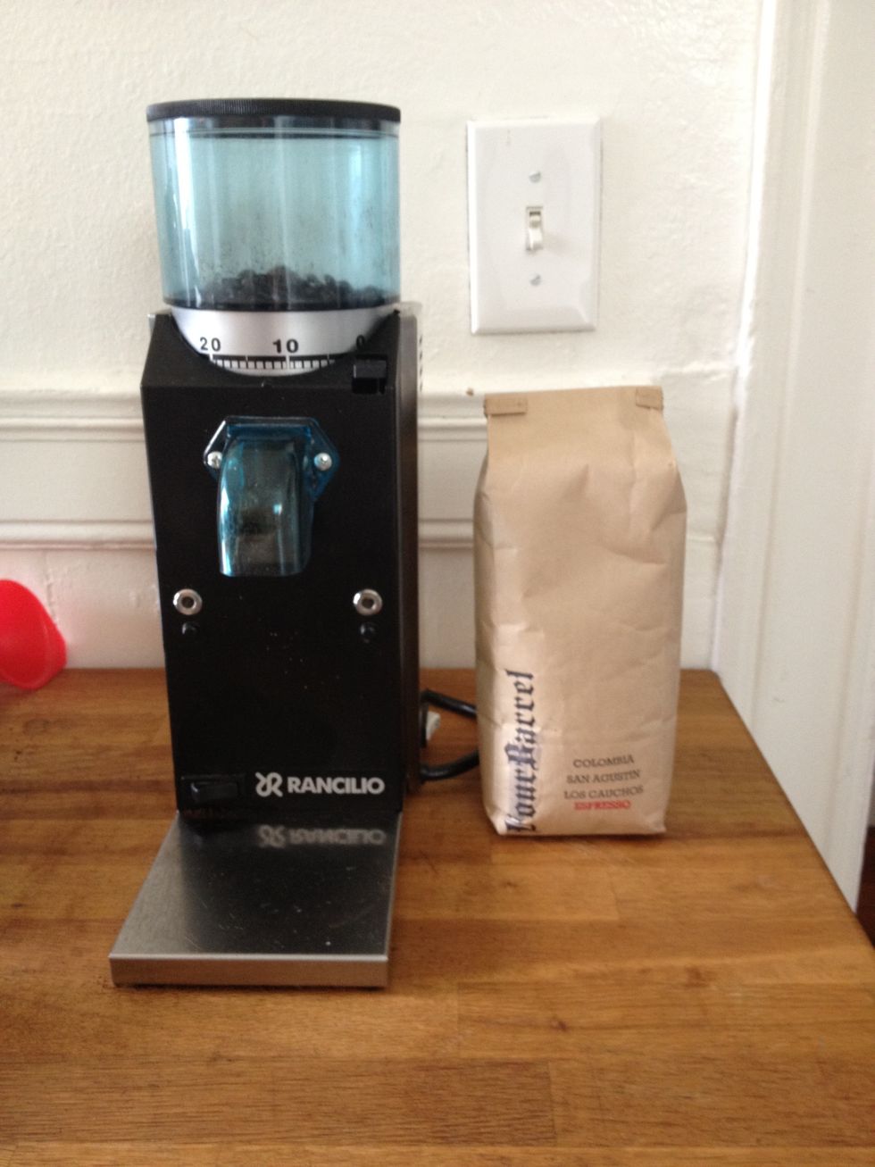 Lever machines are finicky so supplies are important \u2014 especially the grinder & beans. The Rancilio Rocky you see here is an inexpensive option capable of producing an even espresso grind.