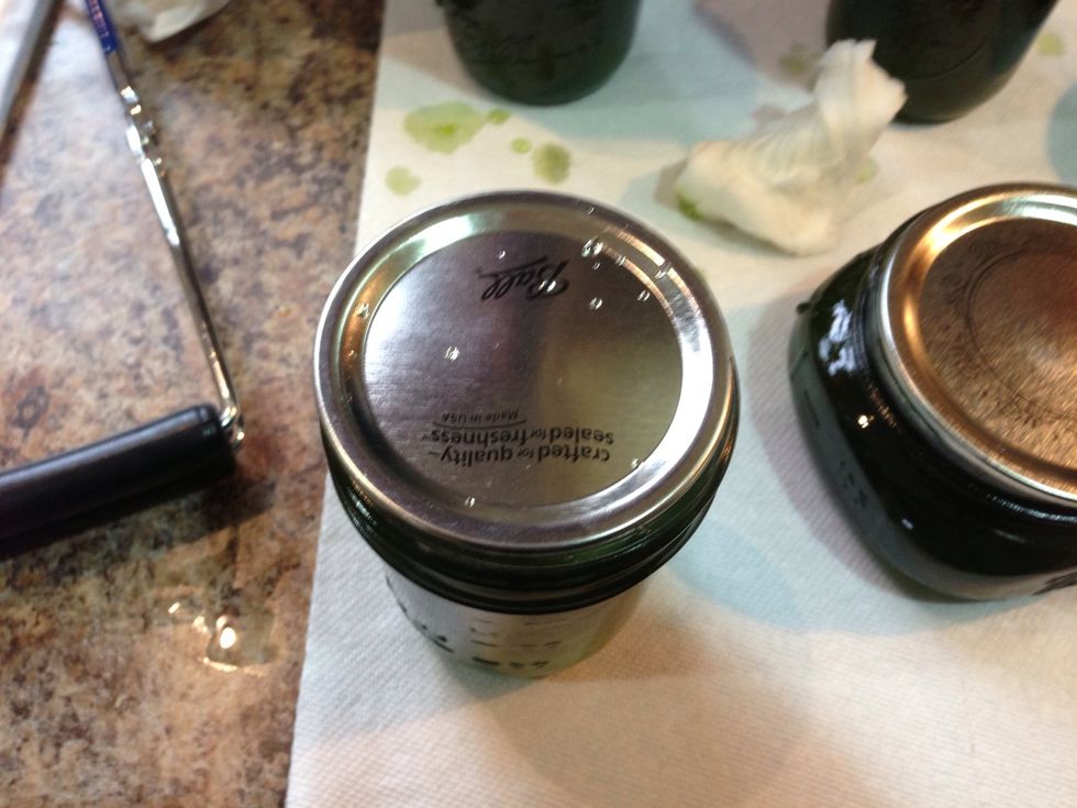 Lid in place now add the ring to hold them down. Be careful this stuff is very hot. You will get burned... Put the lids on finger tight.