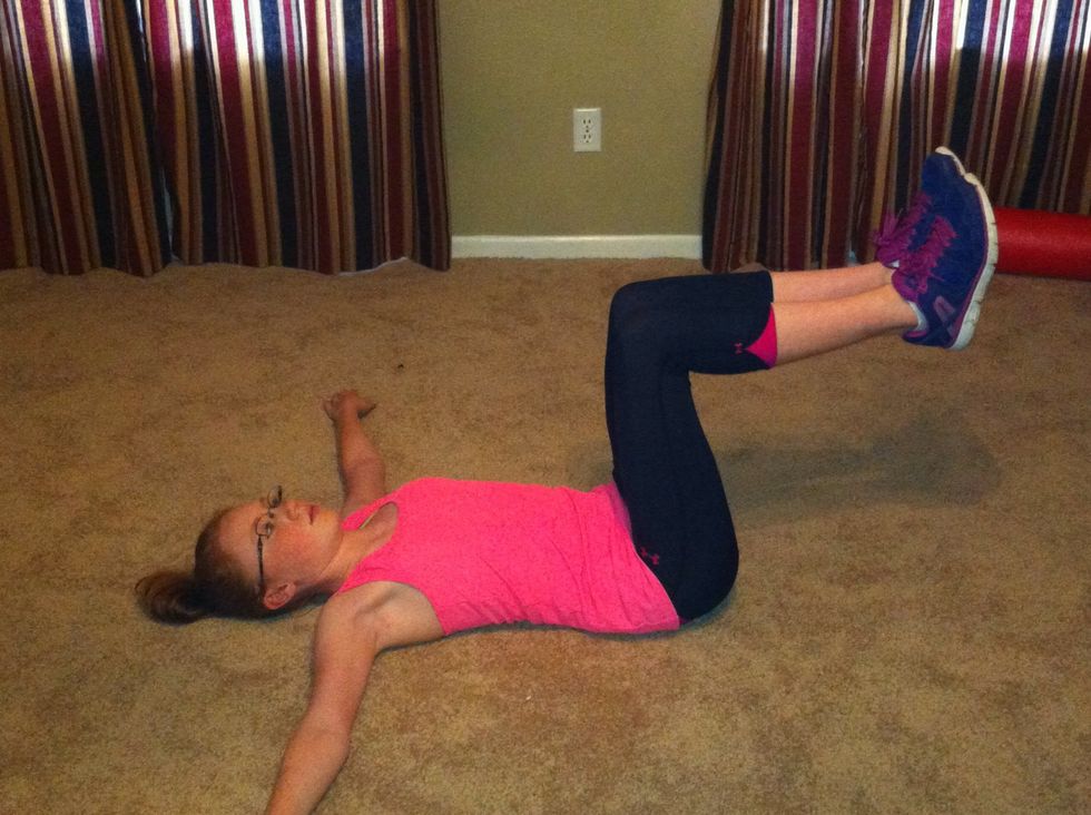 Lie on the floor and bend knees to 90 degrees.