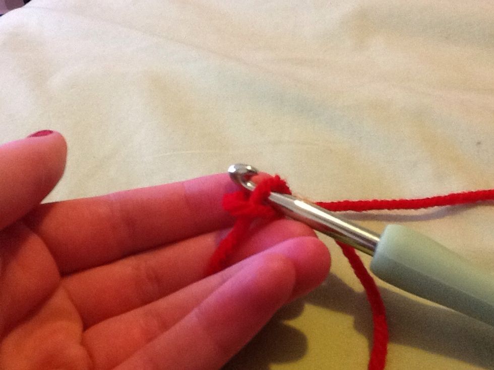 Lift bottom loop over to make a chain, do this over and over until desired length