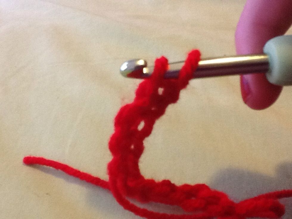 Lift middle loop over wrapped yarn