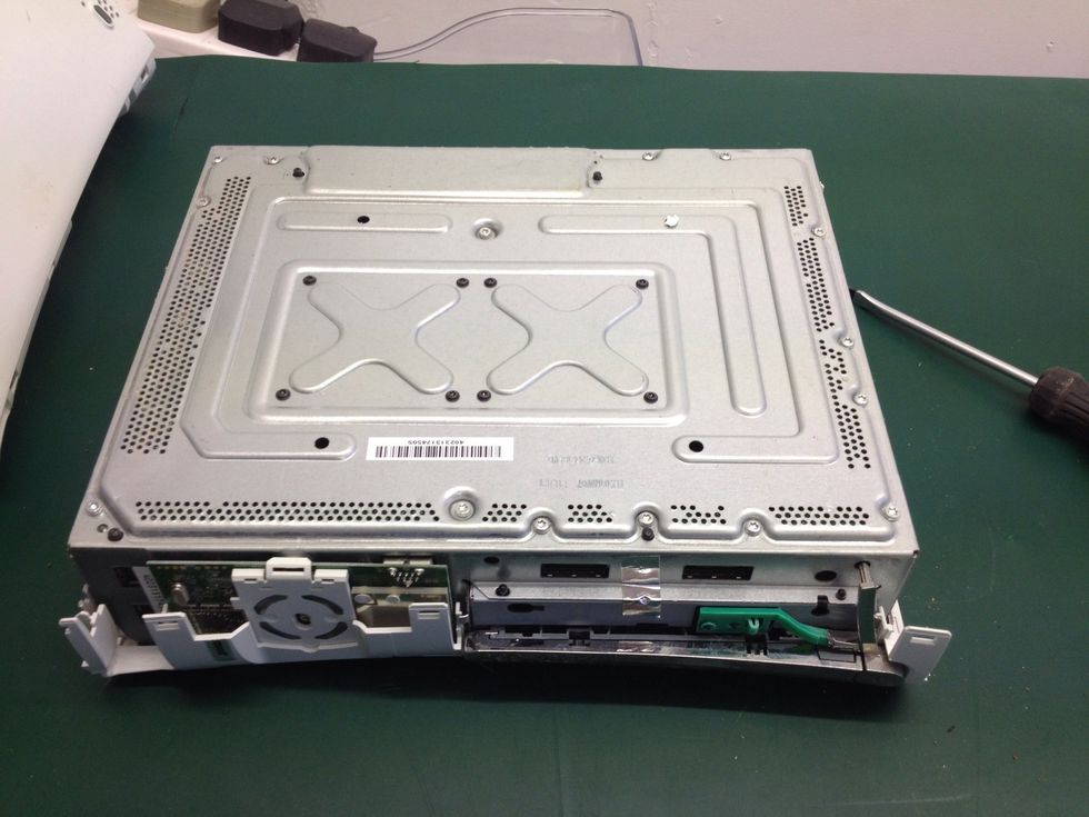 Lift off the bottom part of the case now and lay it flat, naked side facing up as shown.