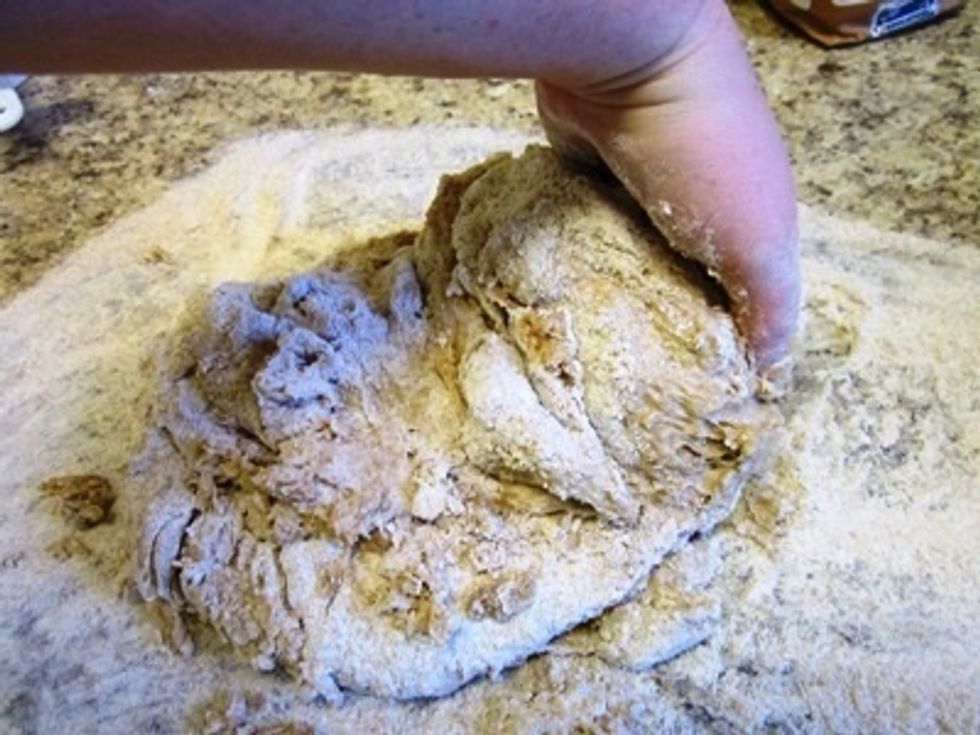 Lift one side of the blob of dough...