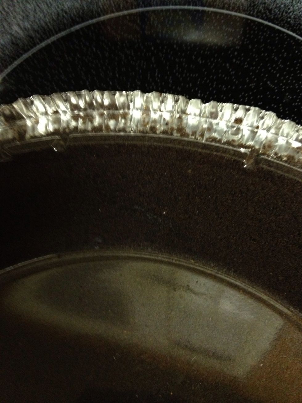 Lift pie tin tab to remove clear protective lid. Set lid to the side for later.