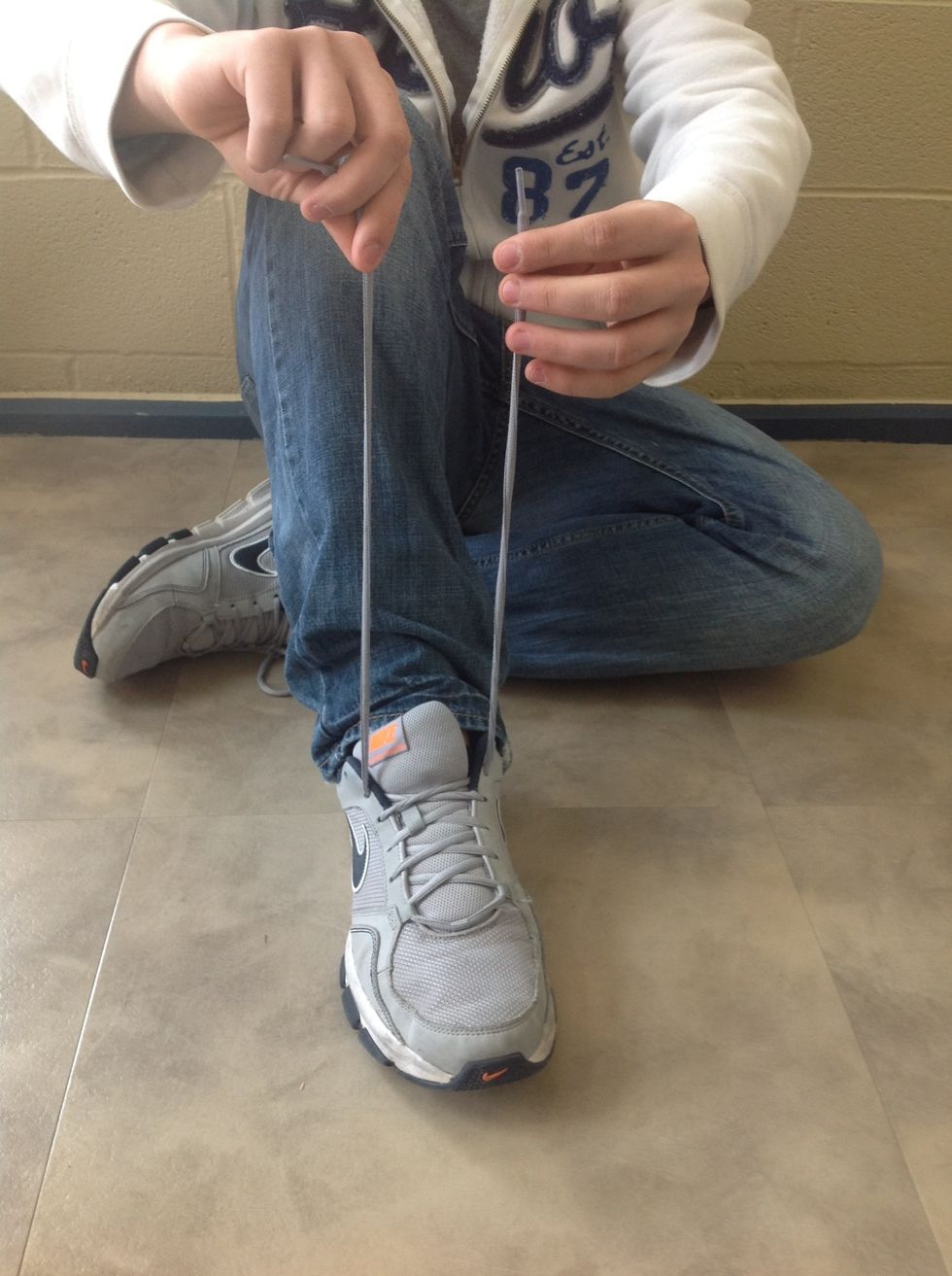 Lift shoe laces up.