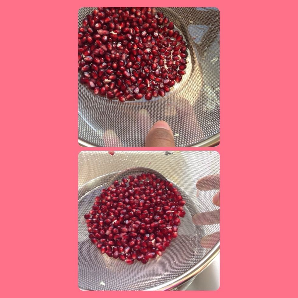 Lift strainer and viola! You've got clean pomegranate seeds! If your strainer did not fit inside the bowl just empty the bowl into the strainer and you'll still have the same results!