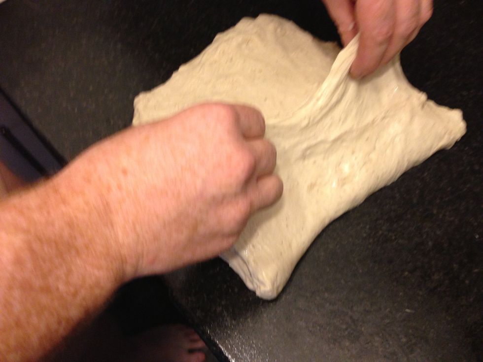 Lift the end and fold it over, laying it about a third of the length from the opposite end.