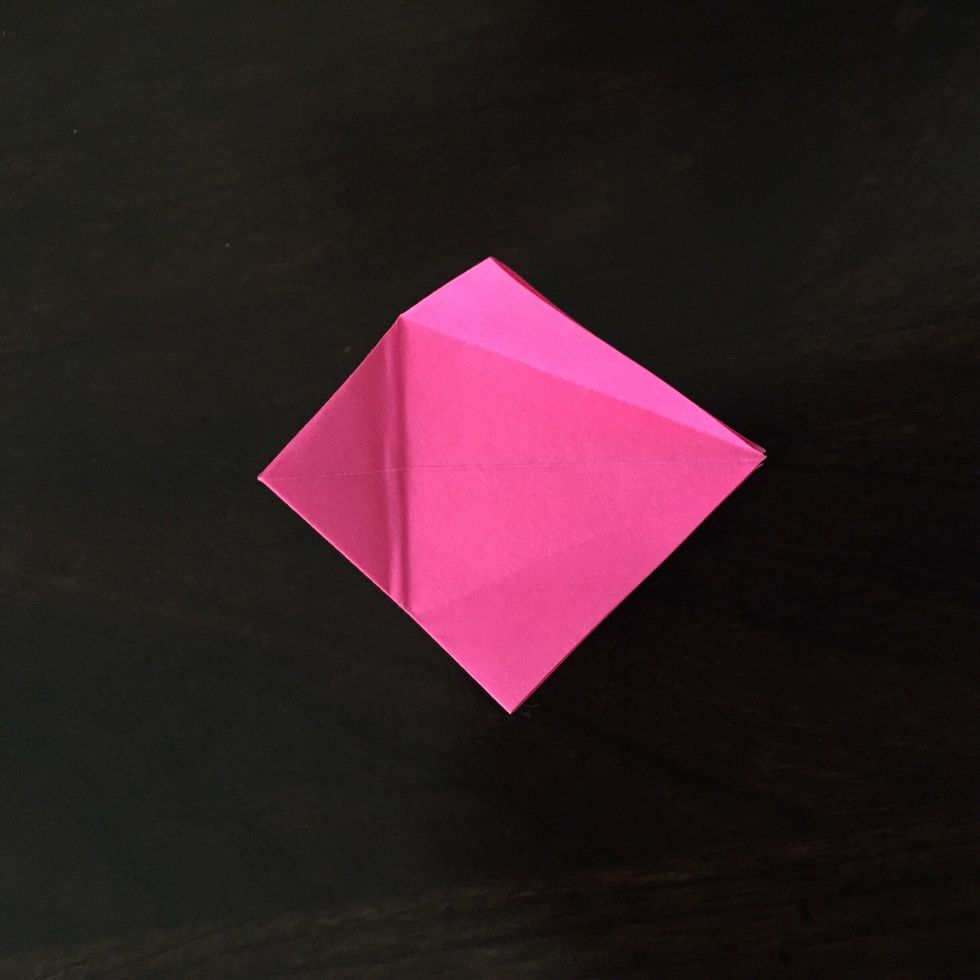 Lift the folded corners up.