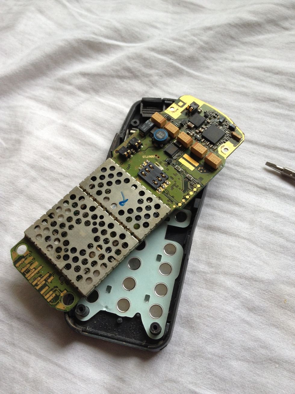 Lift the motherboard out of the housing.