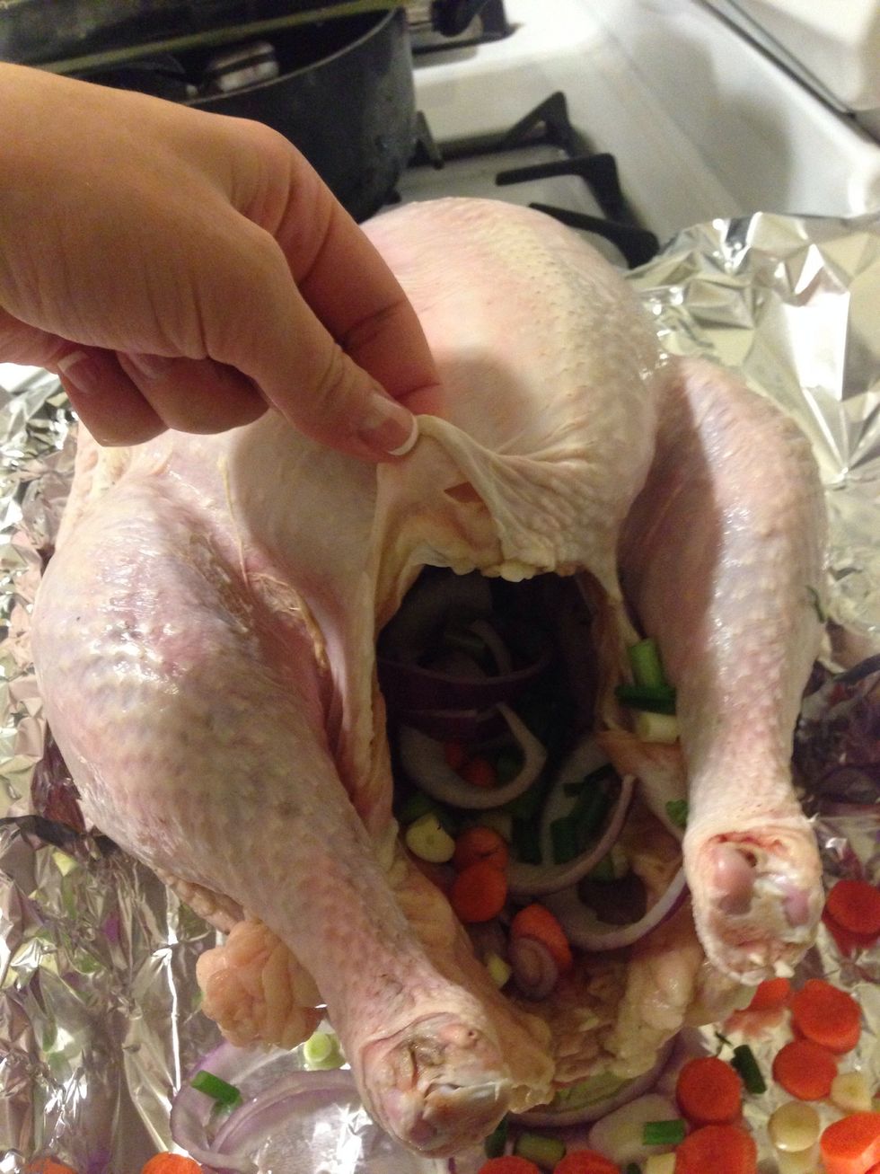 Lift the skin away from the meat on the bottom of the turkey.