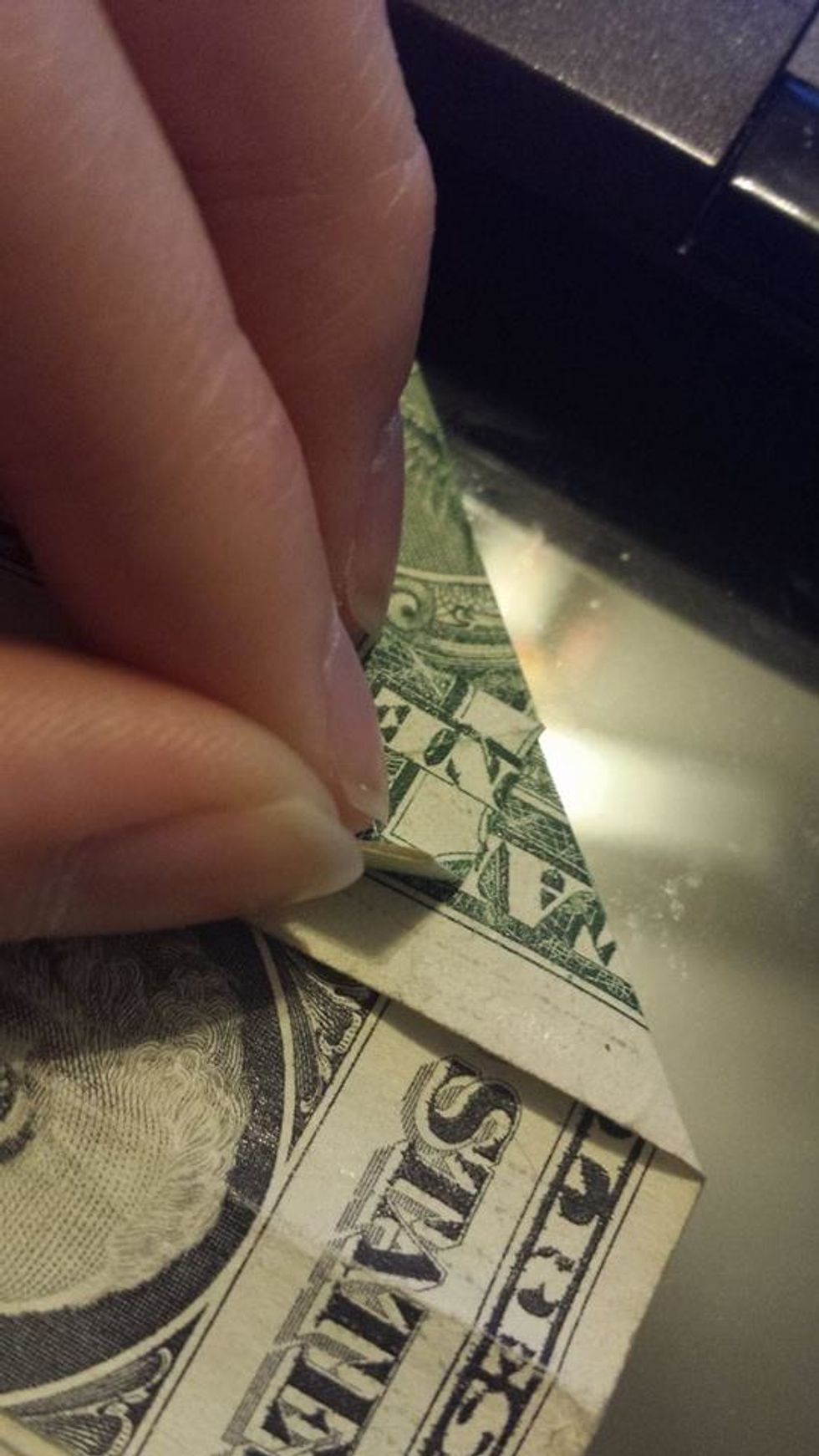 Lift the top layer of the square.