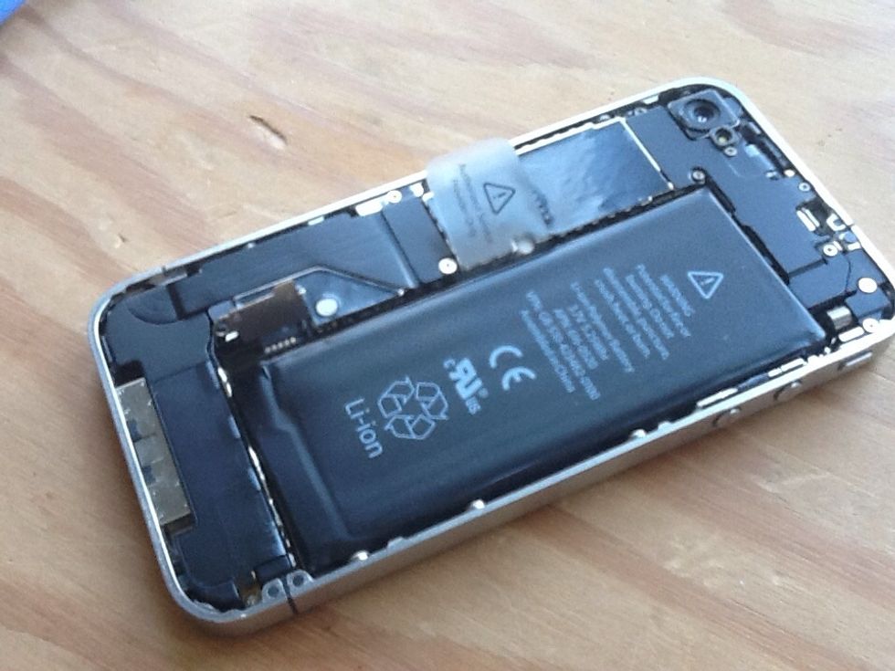 Lift up bracket and gently remove battery connector.