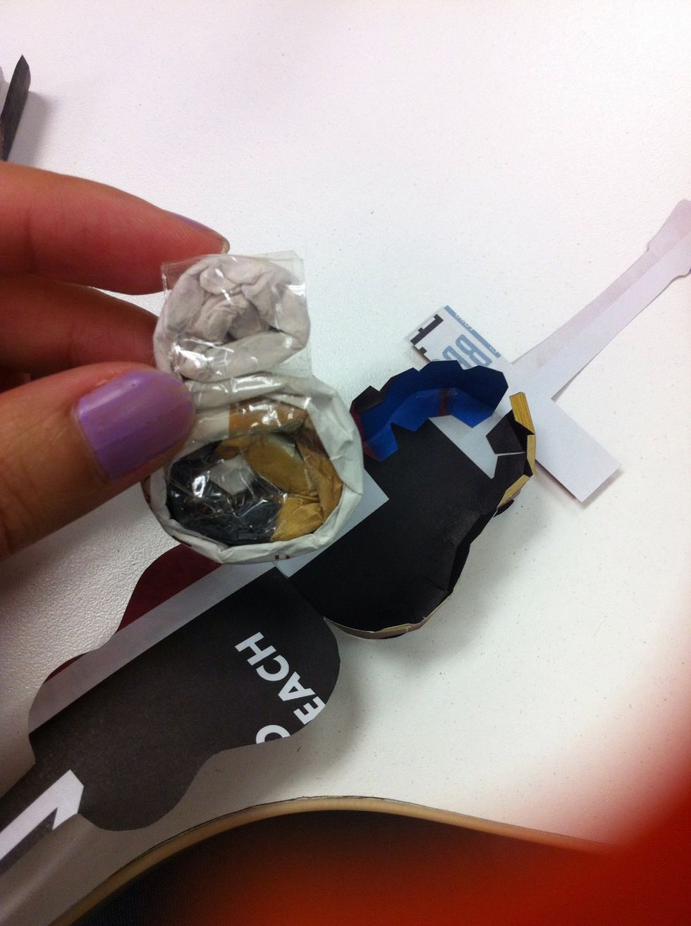 Lift up one side of the model.