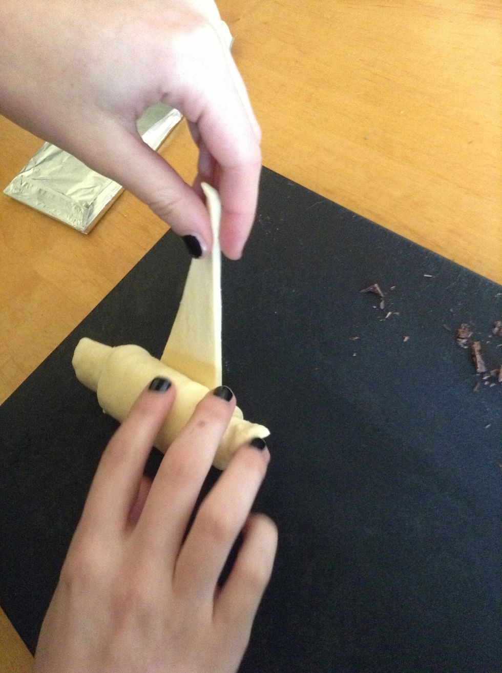 Lift up the tip and stretch it over the roll.