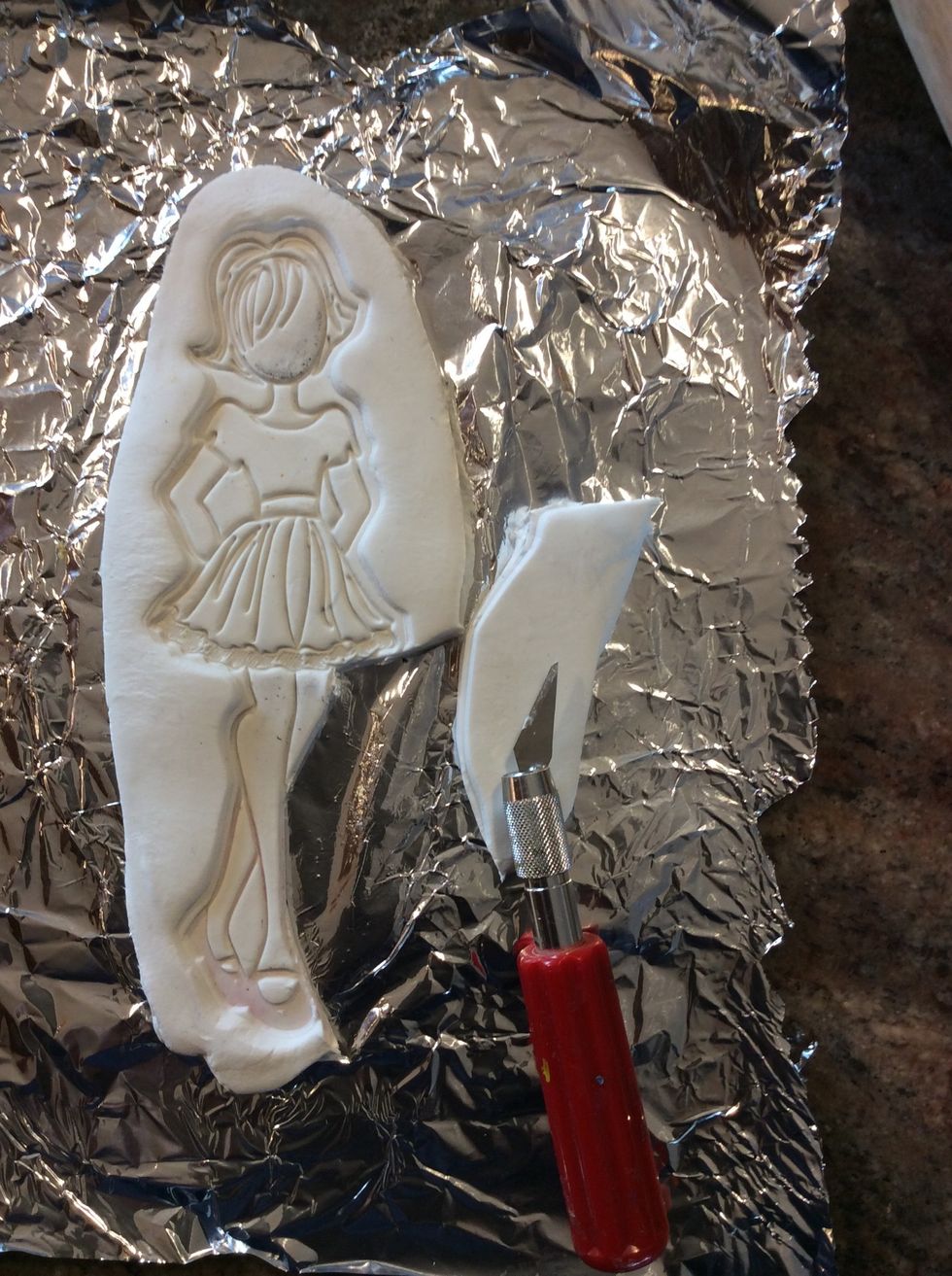 Lift your stamp and cut around the edges with your knife