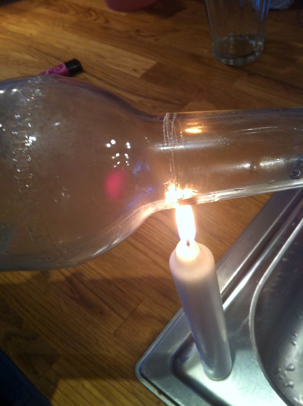 Light a candle and have the flame go on the "scratch" it Will be black But keep rotating all the way around. let it run cold water from the tap