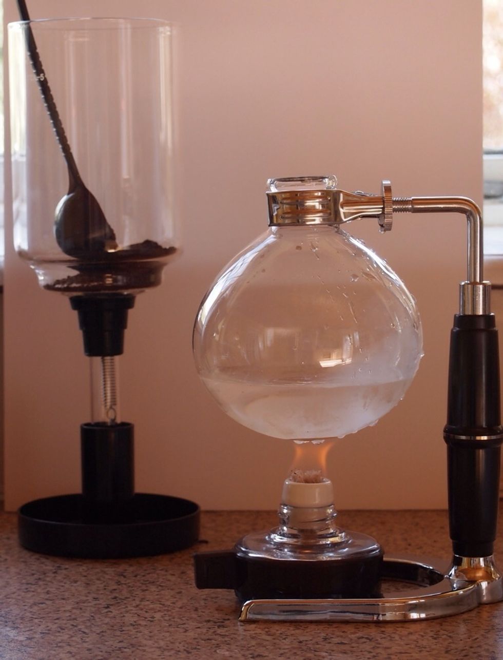 Light the heater (in this case a methylated spirits burner) and apply heat to the lower vessel.