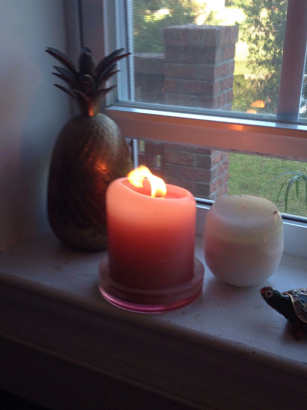 Lighting a candle nearby and next to an open window helps clear away the smoke.