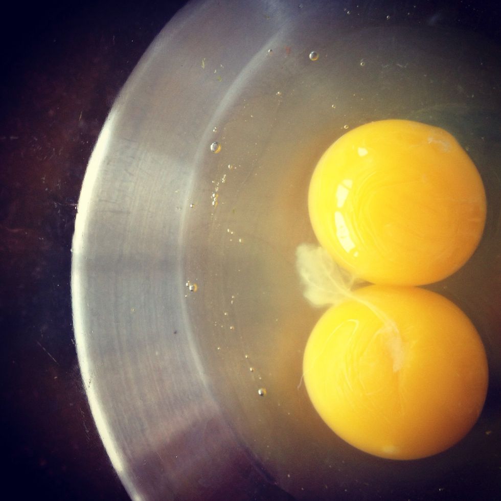 Lightly beat 2 eggs,