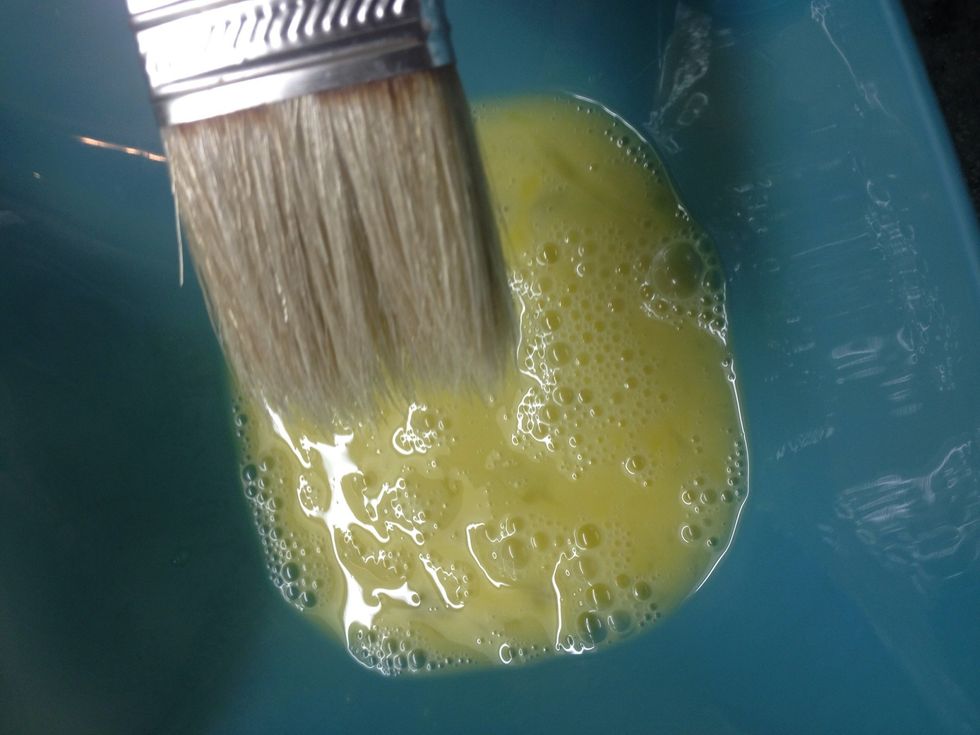 Lightly beat an egg and using a brush generously apply to the surface of your pie. At this point I like to put the pie dish on a baking tray to make sure the drips are contained.