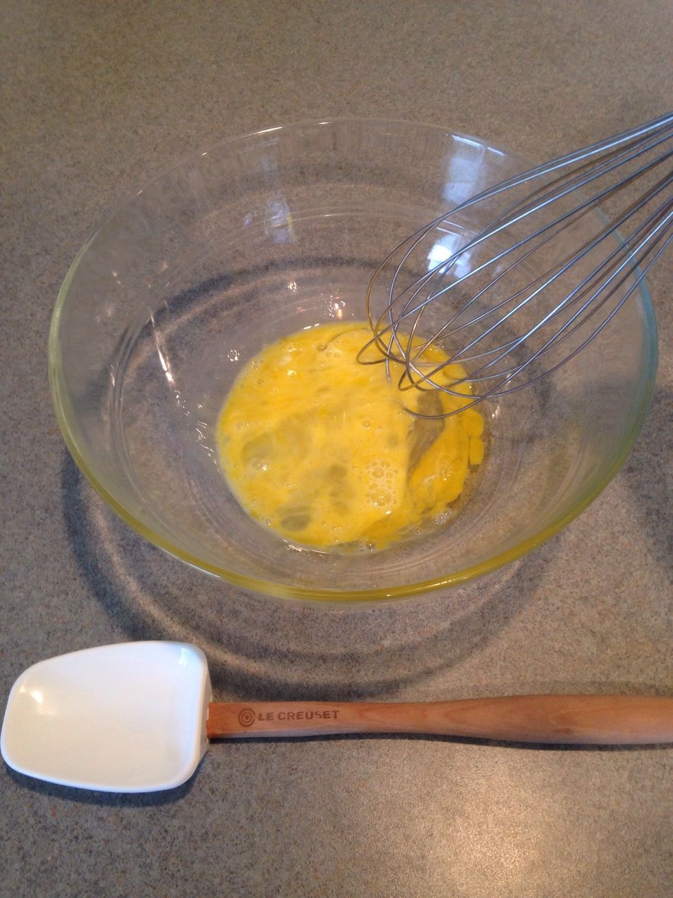 Lightly beat the egg.