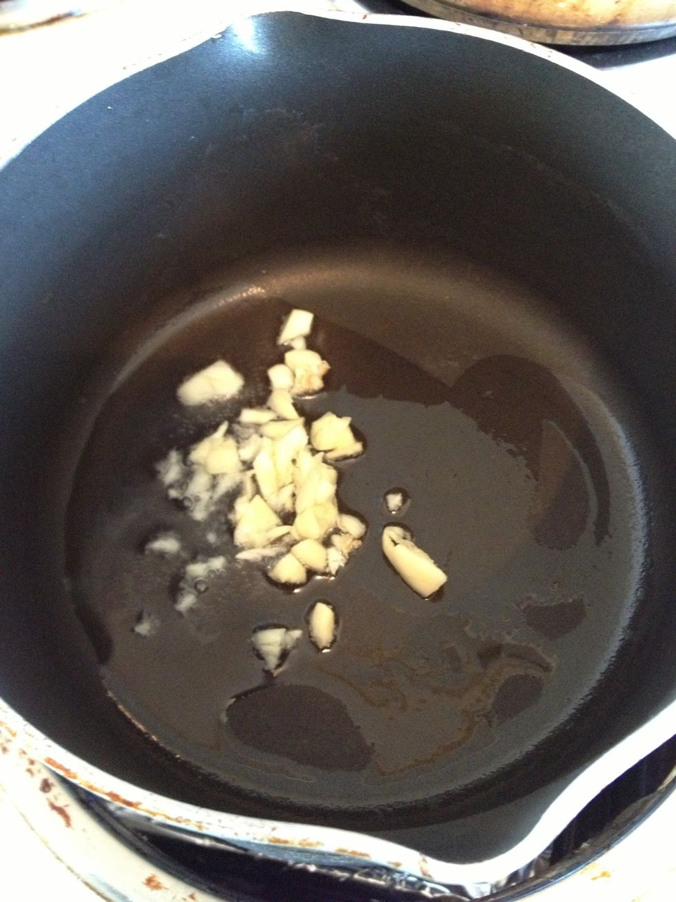 Lightly brown the garlic when oil is hot