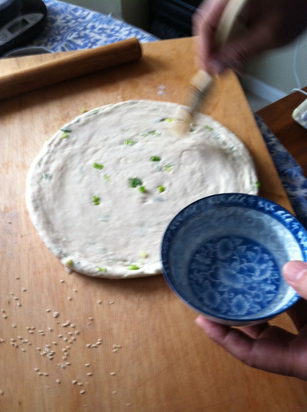 Lightly brush the surface of the pie with water.