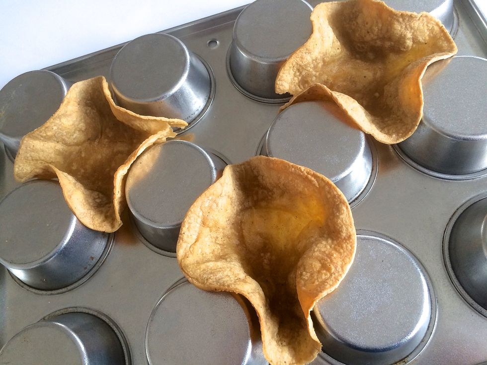 Lightly brush tortillas with oil and bake in an upside-down muffin pan. For more recipe info: http://frommeat2roux.com/2015/01/31/mini-burrito-bowls/