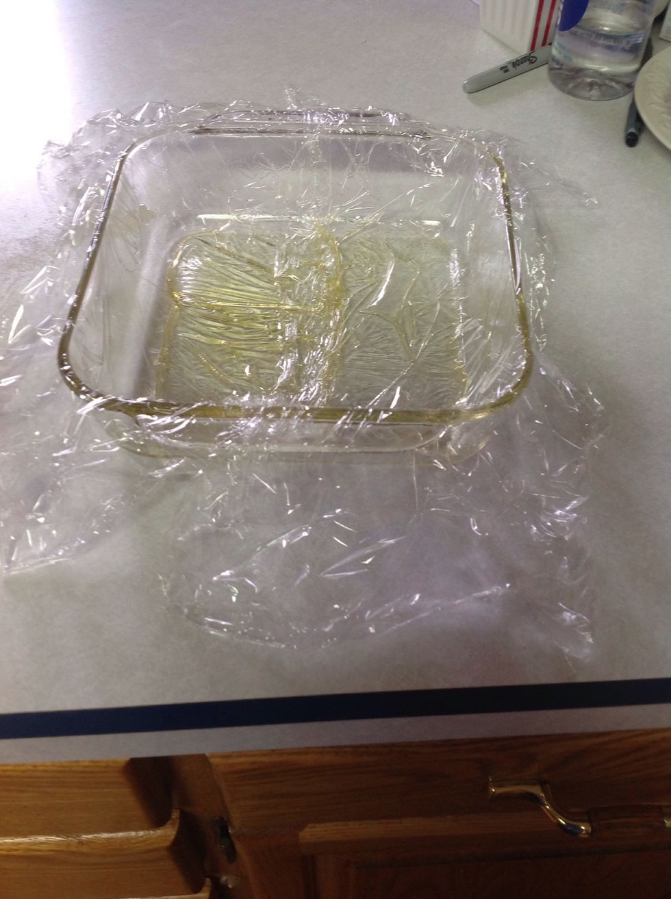 Lightly coat a 8 inch pan with cooking spray, then line with plastic wrap (leave 6 inches on 2 sides).