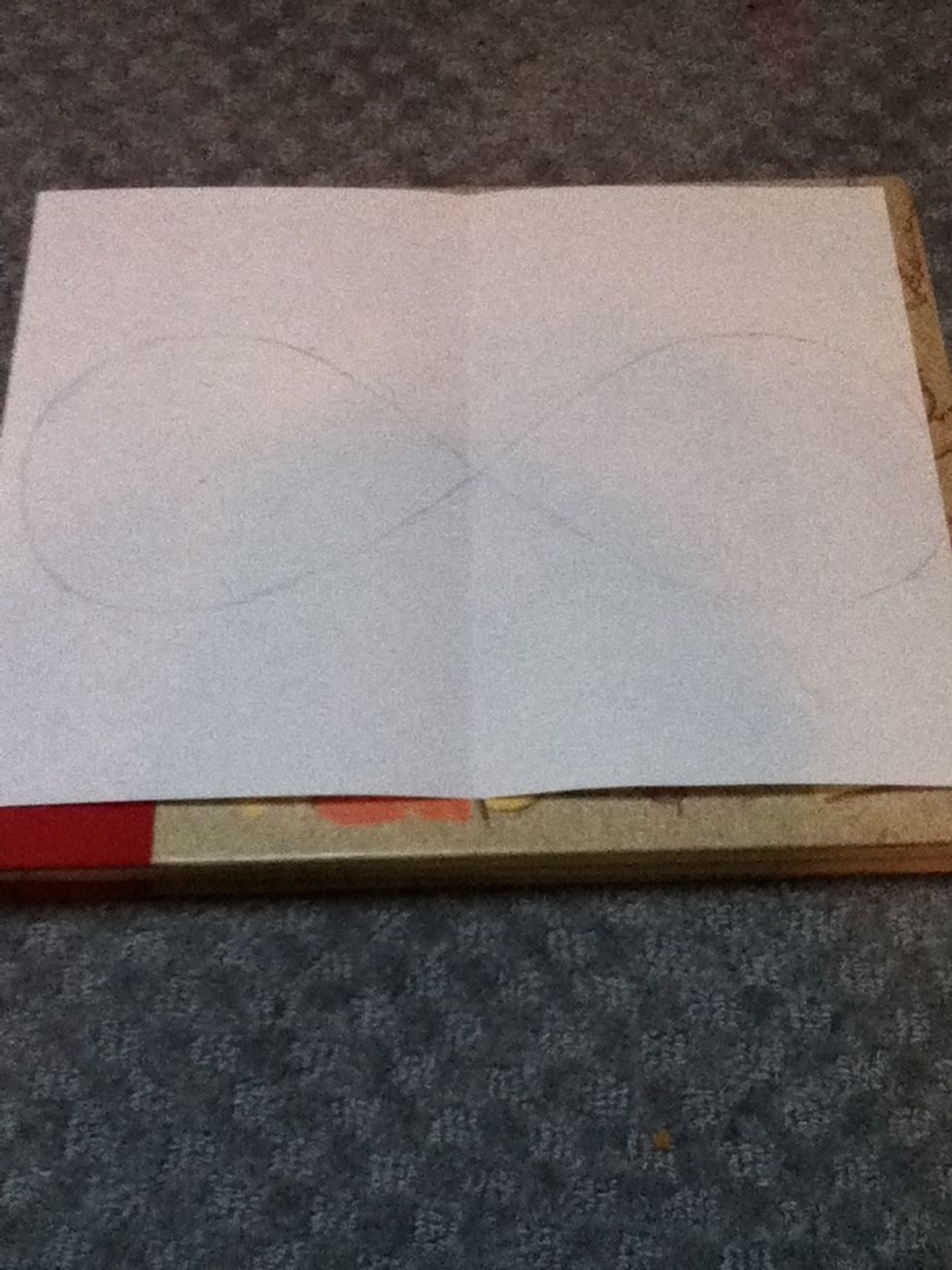 Lightly draw the infinity sign