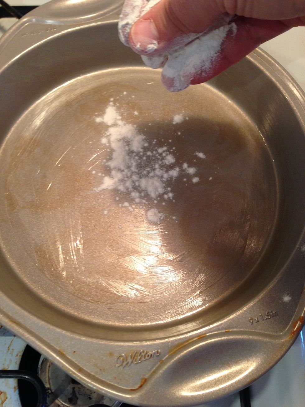 Lightly dust each pan with some flour, so there is a nice and even light coat of flour on the bottom and sides inside the pan.