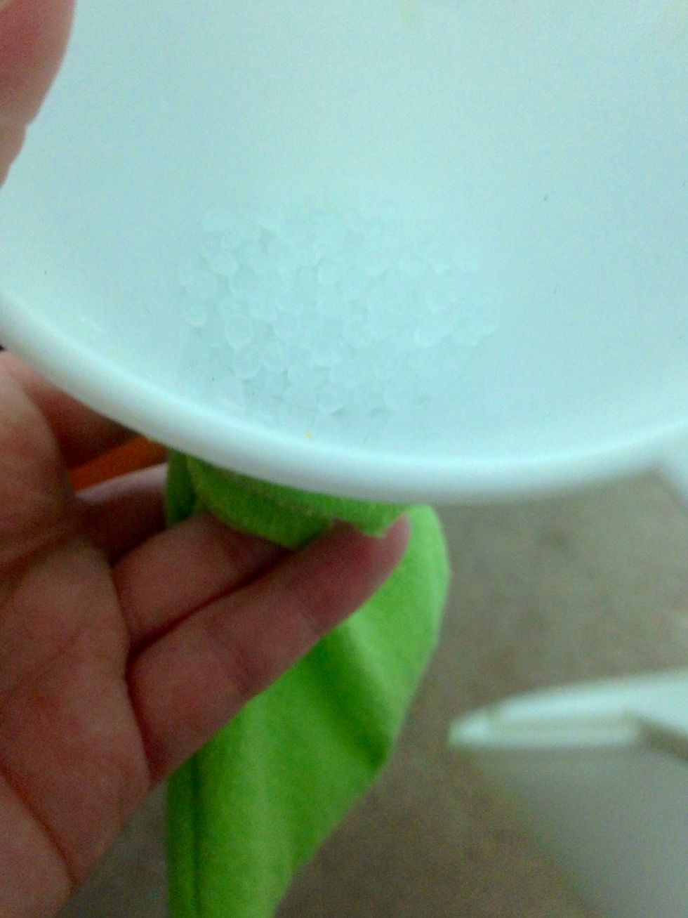 Lightly fill the bean bag. I'm using poly beads, but I happen to have then from other crafting projects. You can use beans, etc. in a pinch. Stitch gap shut.