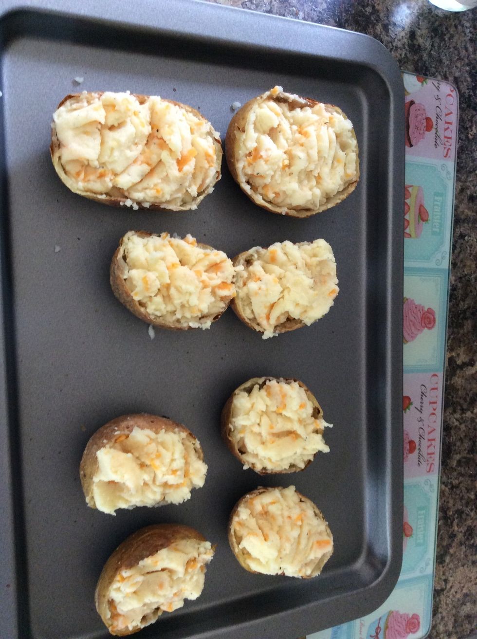 Lightly fill the skins with the mashed potato.