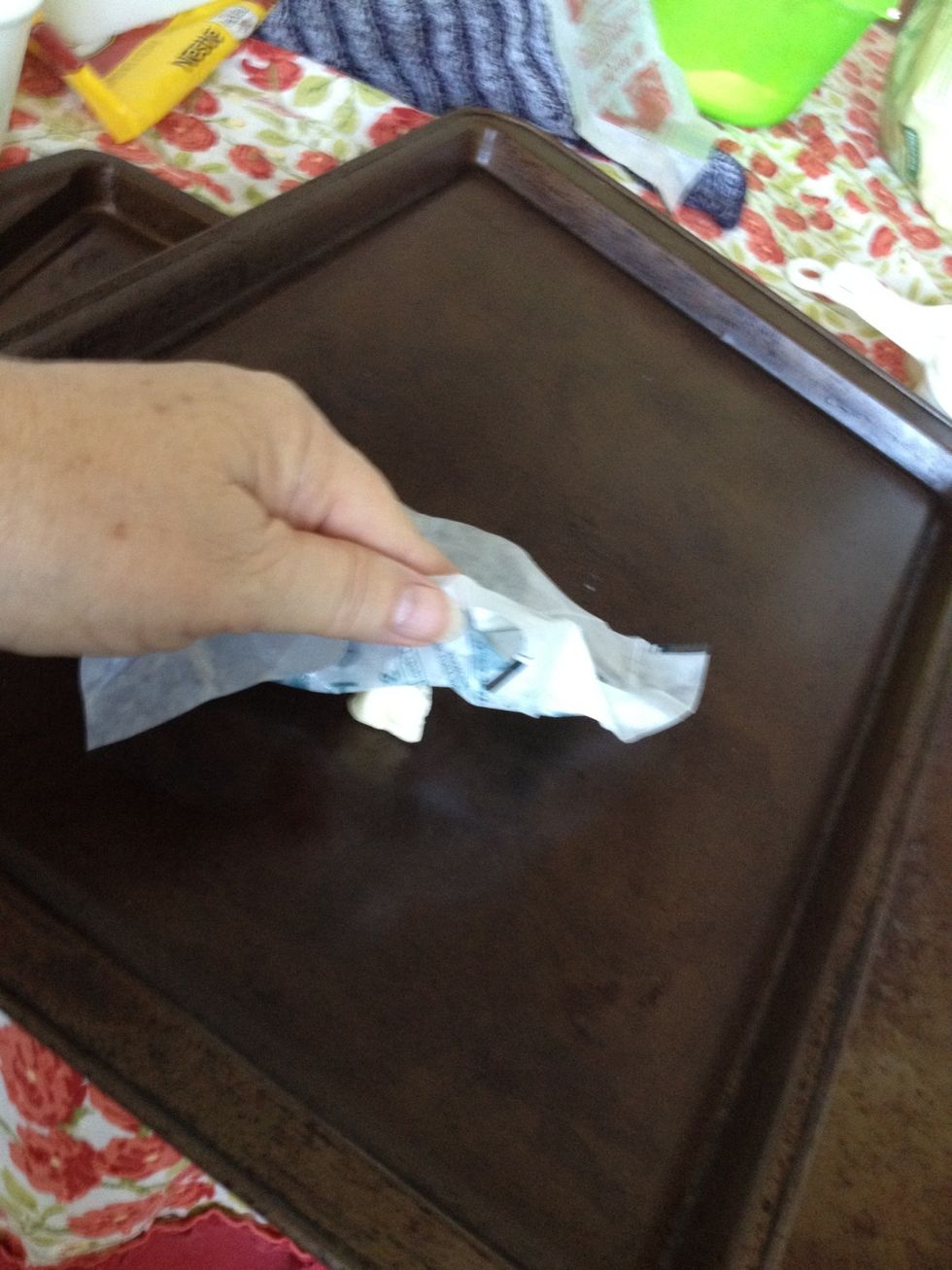 Lightly grease cookie sheets with butter.