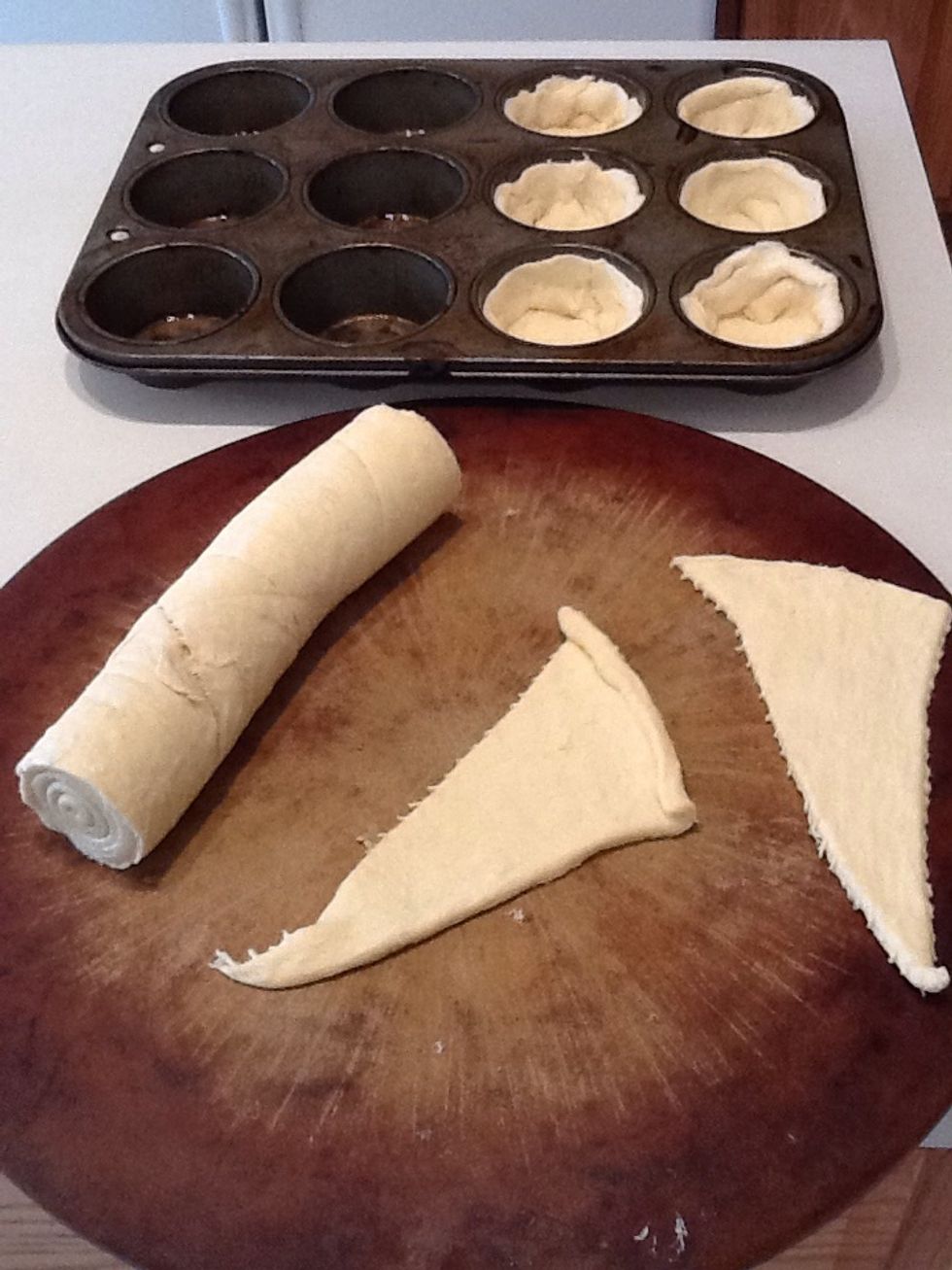 Lightly grease muffin pan. Unroll crescent rolls and place in pan. Shape each to create a cup. If you will have some leftover rolls, bake them separately as rolls or make pizza rollups (posted!)