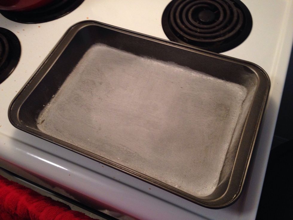 Lightly grease your cookie sheet and cover it with a thin layer of flour. Shake off any excess flour that doesn't stick. Preheat your oven to 350F (180C).