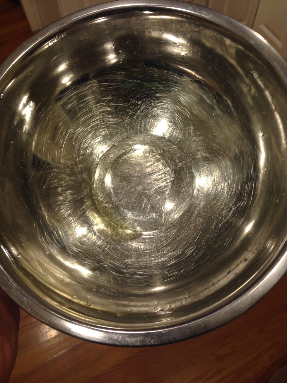 Lightly oil a large mixing bowl.