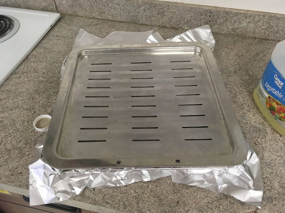 Lightly oil the grid of the broiler pan and line the bottom with foil