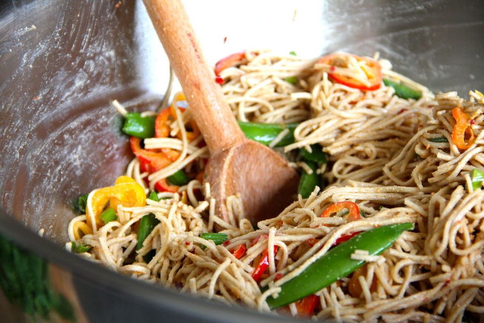 Lightly oil the noodles with canola to keep them from sticking, then pour in the sauce and add the veggies. Mix well and add more of whatever you like. Serve with cilantro and lime wedges. :)