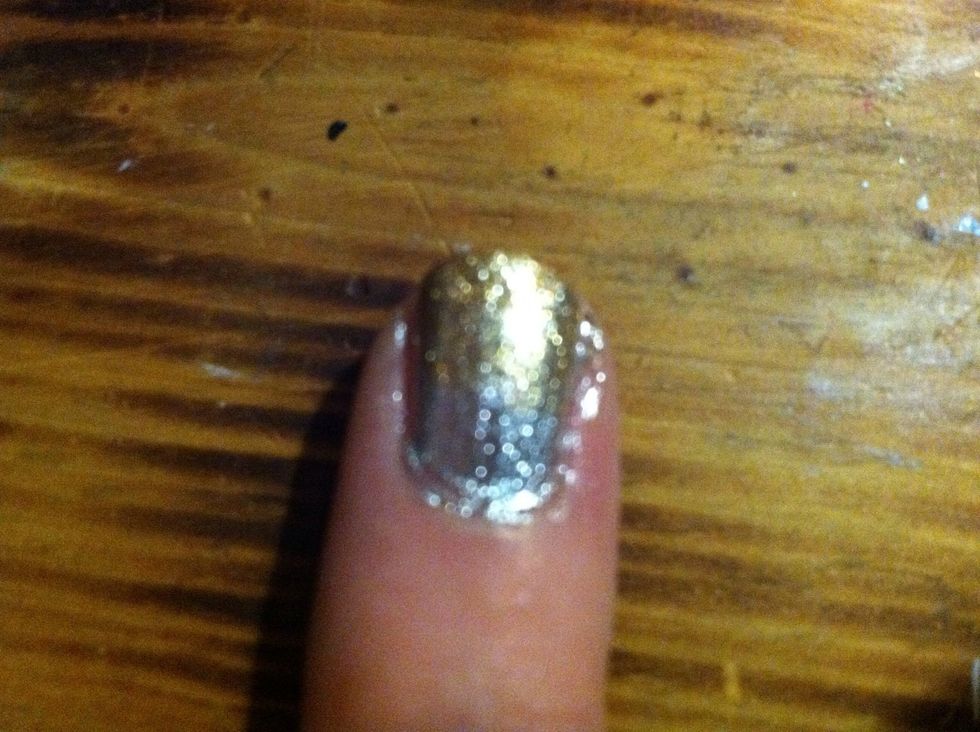 Lightly paint silver nail two thirds gold, painting it thicker near the tips.