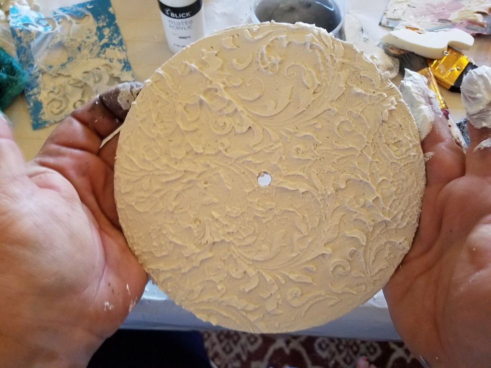 Lightly sand both disc being careful not to sand the pattern off. You just want to get the top even Be sure to shake or Brush off dust from sanding and paint both circles