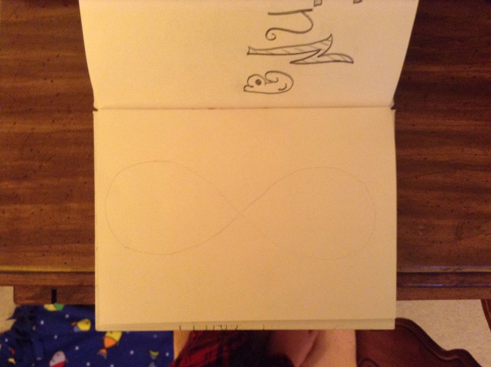Lightly sketch an infinity sign